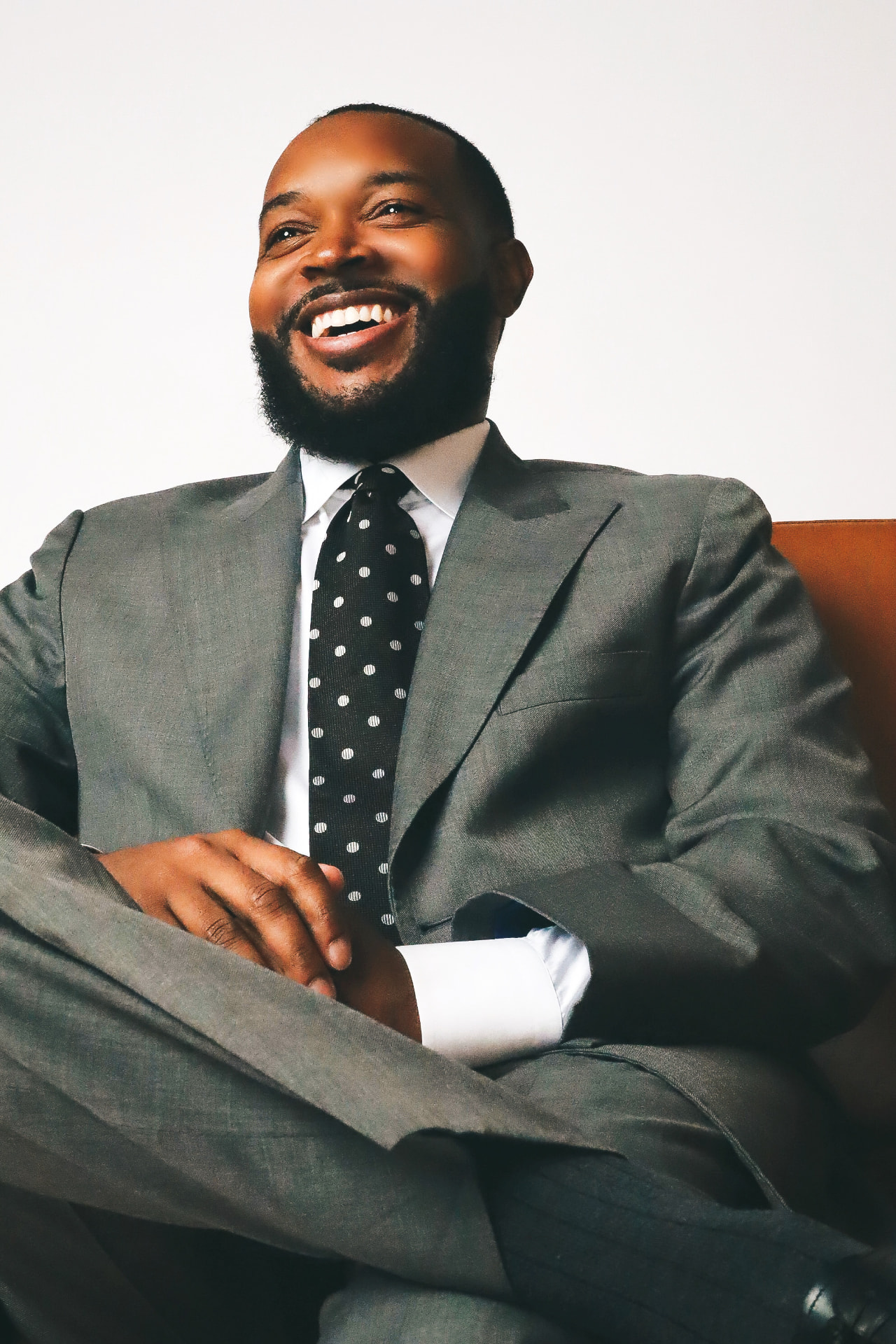 Carlton Pulley smiling in a grey suit