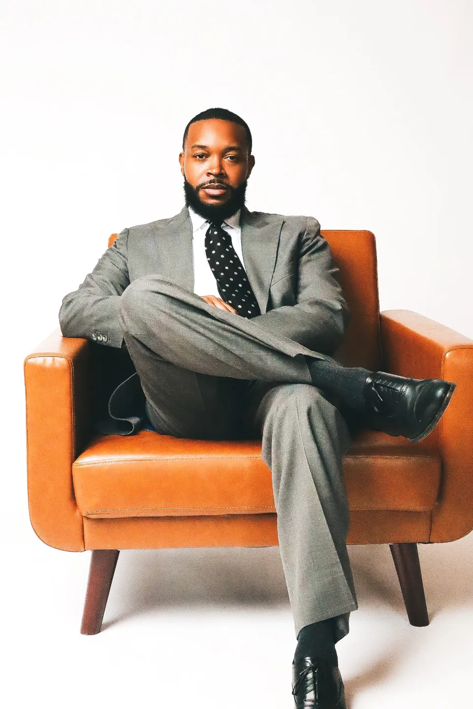Carlton Pulley seated in a grey suit